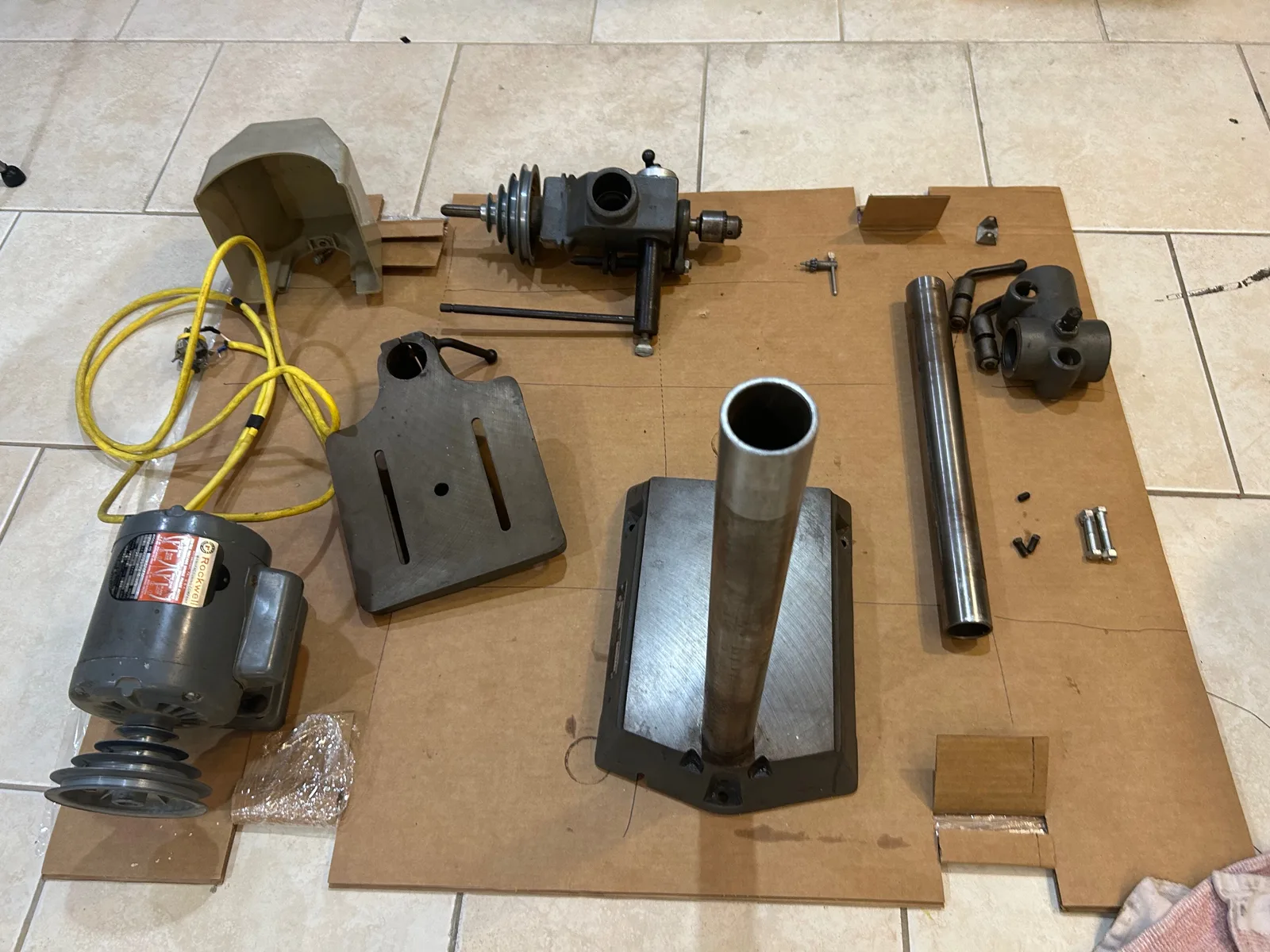 Every part laid out on cardboard after disassembly