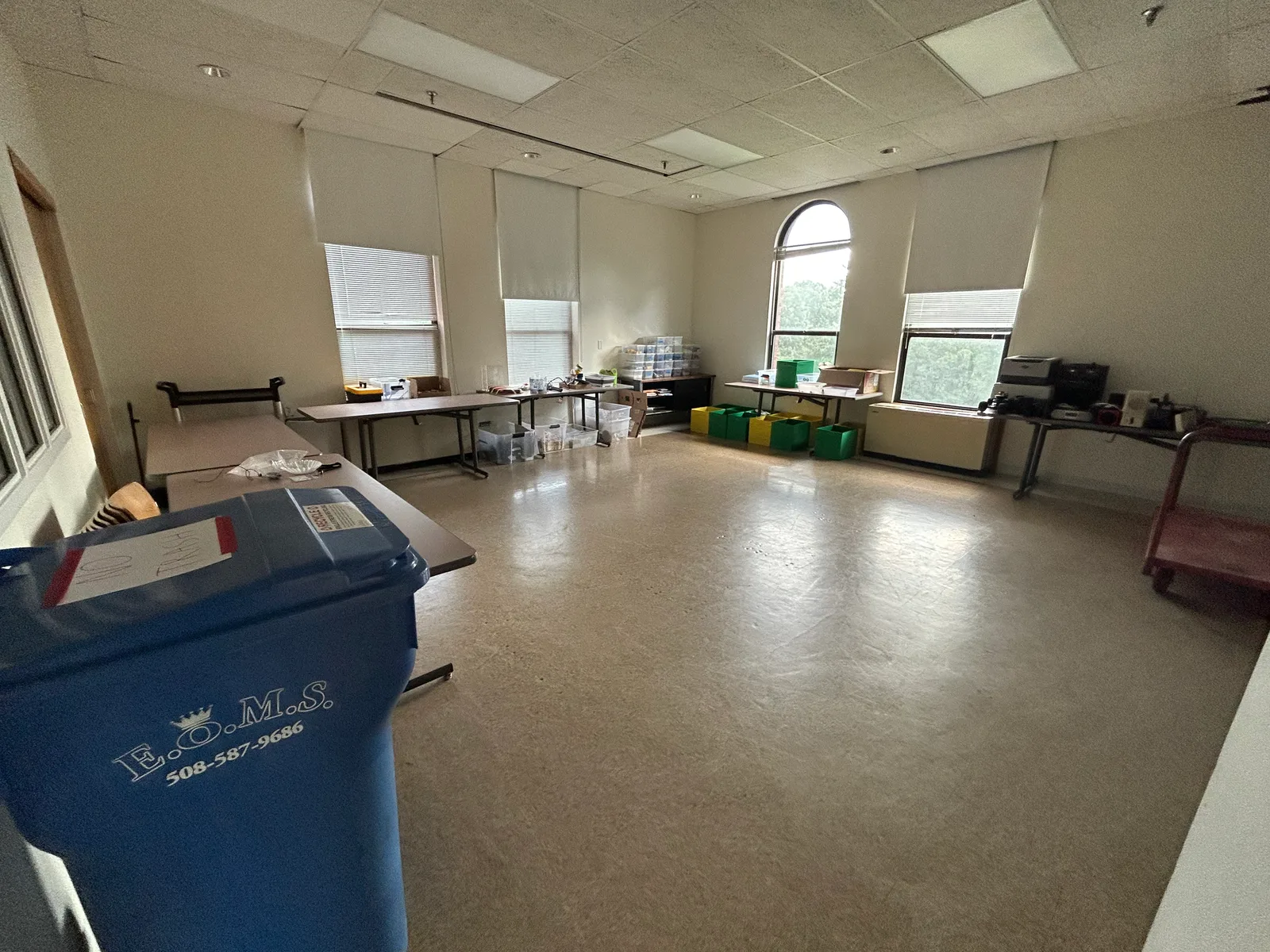 The room between sessions, tables cleared and bins ready