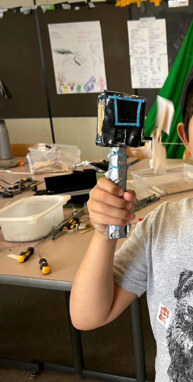 A handheld build with a salvaged screen on a grip