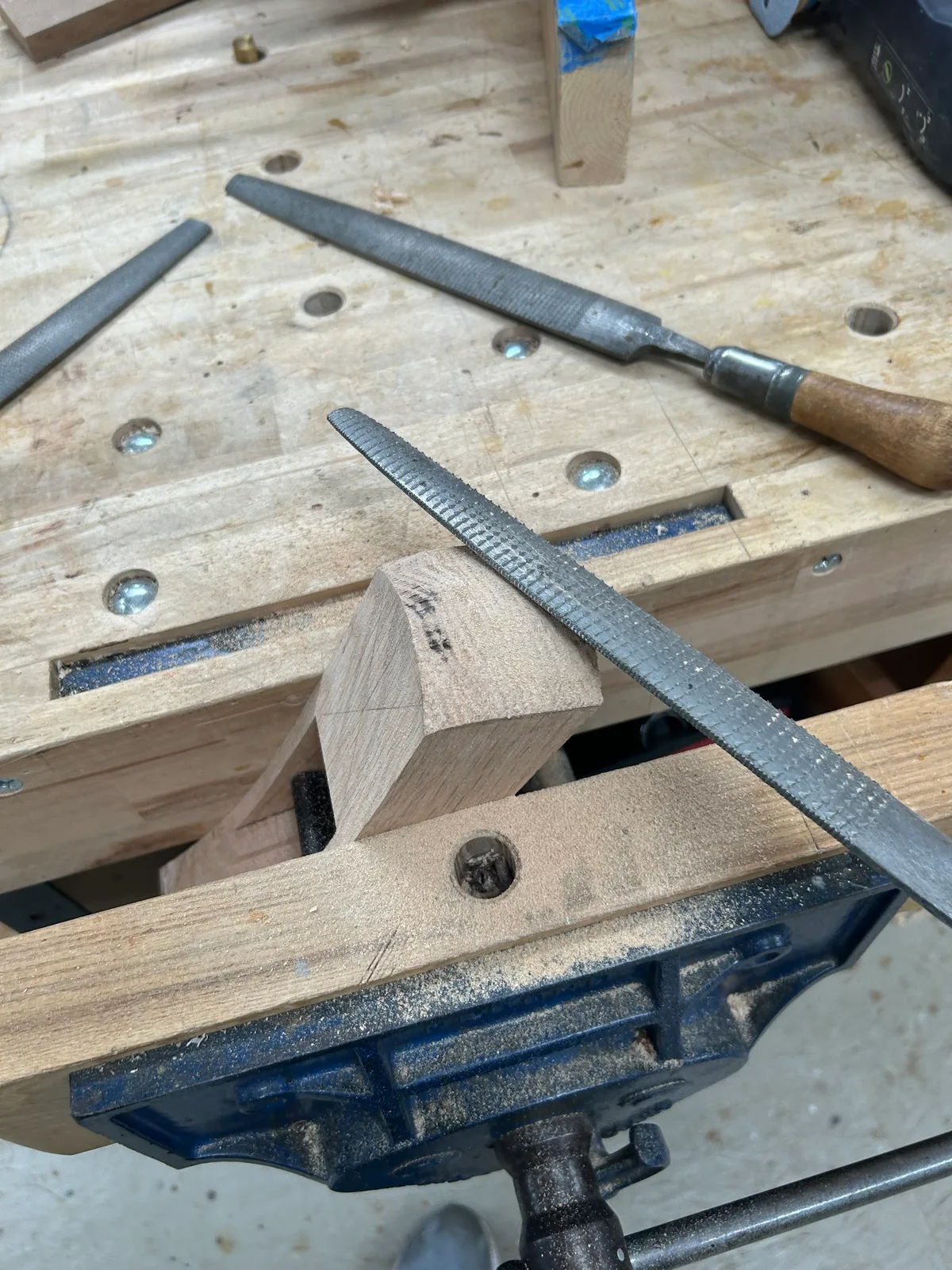 Shaping with a rasp at the vise