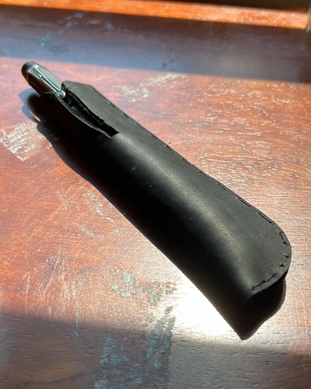 The sheath with the pen in it