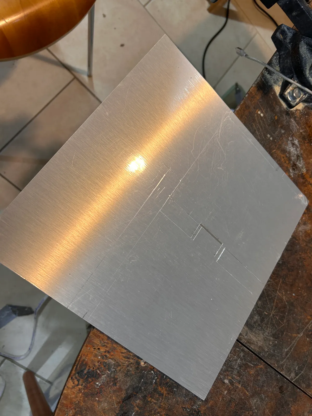 1/8-in aluminum sheet marked out for cutting
