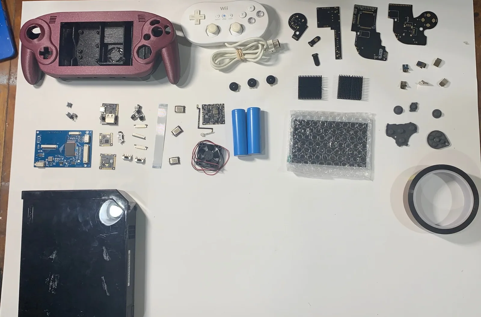 Parts layout: printed shell, BitBuilt boards, screen, 18650 cells, fan and donor controller