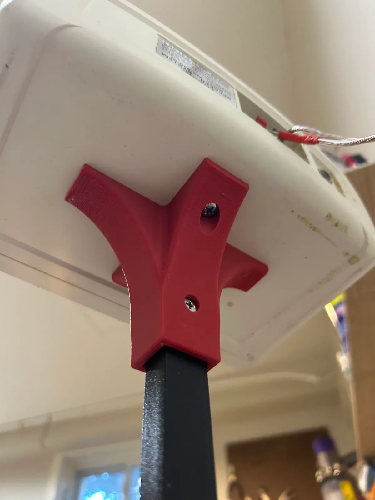 The printed top bracket under the speaker