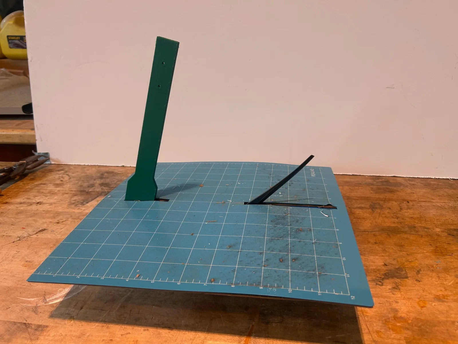 The finished prototype on its cutting mat, lever up.