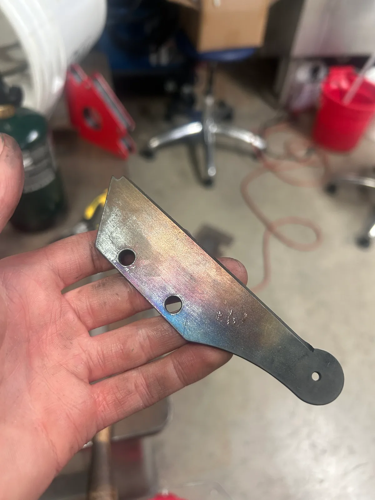Heat treating: bringing the 1084 blade to red heat with torches, quench bucket ready.