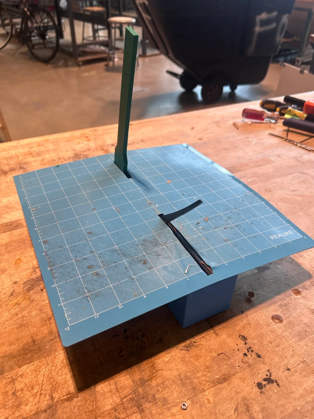 Cutting mat fitted over the housing, blade in its slot.